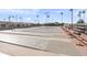 Outdoor shuffleboard court with multiple lanes and spectator seating, perfect for friendly competition and recreation at 4306 E Dragoon Cir, Mesa, AZ 85206