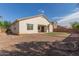 The backyard features a spacious layout with a gravel area and small patch of lawn at 4335 E Sleighbell Dr, Gilbert, AZ 85297