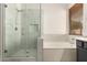 Bathroom featuring a glass shower, bathtub, and neutral finishes at 4335 E Sleighbell Dr, Gilbert, AZ 85297