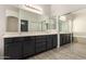 Bathroom features double sinks, a large mirror, vanity, and a walk in shower at 4335 E Sleighbell Dr, Gilbert, AZ 85297