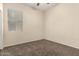 Carpeted bedroom with a window for natural light at 4335 E Sleighbell Dr, Gilbert, AZ 85297