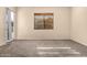 Bedroom features a door to the outside, and window with natural light at 4335 E Sleighbell Dr, Gilbert, AZ 85297