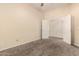 Comfortable carpeted bedroom with a ceiling fan, a closet, and neutral walls, ready for personalization at 4335 E Sleighbell Dr, Gilbert, AZ 85297