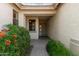 Inviting home entrance with desert landscaping, a covered porch, and a glimpse of the front door at 4335 E Sleighbell Dr, Gilbert, AZ 85297