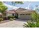 Charming single-story home featuring a two-car garage, well-maintained landscaping, and a welcoming entrance at 4335 E Sleighbell Dr, Gilbert, AZ 85297
