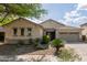 Lovely single-story home with a two-car garage, desert landscaping, and a well-kept front yard at 4335 E Sleighbell Dr, Gilbert, AZ 85297