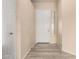 Bright foyer featuring wood-look flooring, a white front door, and neutral paint, creating a welcoming entrance at 4335 E Sleighbell Dr, Gilbert, AZ 85297
