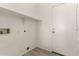 Functional laundry room with white walls, shelving, and hookups for laundry machines at 4335 E Sleighbell Dr, Gilbert, AZ 85297