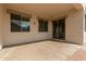 Covered patio with concrete flooring and sliding glass doors, perfect for outdoor enjoyment at 4335 E Sleighbell Dr, Gilbert, AZ 85297