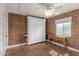Flexible space with murphy bed, desk, and brick accent wall, suitable for various uses at 4401 E Hubbell St # 57, Phoenix, AZ 85008