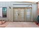 Patio with door access featuring sidelights, brick flooring, and neutral paint at 4401 E Hubbell St # 57, Phoenix, AZ 85008