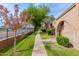 Beautiful community featuring brick exteriors, lush green lawns, and well-manicured landscaping at 4401 E Hubbell St # 57, Phoenix, AZ 85008