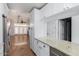 Open-concept kitchen with granite countertops, white cabinetry, and views to the living area, great for entertaining at 4401 E Hubbell St # 57, Phoenix, AZ 85008