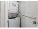 Cozy laundry area featuring a stacked washer and dryer, and next to a white door at 4401 E Hubbell St # 57, Phoenix, AZ 85008