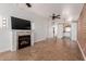 Inviting living room featuring a fireplace, tile floors, and an open floor plan at 4401 E Hubbell St # 57, Phoenix, AZ 85008