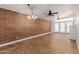 Bright living space with high ceilings, tile floors, and stylish lighting fixtures at 4401 E Hubbell St # 57, Phoenix, AZ 85008