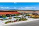 Community park featuring a covered seating area, lush landscaping, and playground nearby at 4417 S 126Th Ave, Avondale, AZ 85323