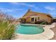 Lush backyard features refreshing pool, desert landscaping, covered patio and privacy fence at 4434 E Thistle Landing Dr, Phoenix, AZ 85044