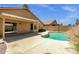 Inviting backyard oasis with pool, patio, and desert landscaping perfect for entertaining at 4434 E Thistle Landing Dr, Phoenix, AZ 85044