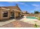 Private backyard with pool, patio, and beautiful desert landscaping for outdoor enjoyment at 4434 E Thistle Landing Dr, Phoenix, AZ 85044