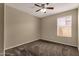 Cozy bedroom featuring a ceiling fan and soft carpeting, perfect for relaxation and rest at 4434 E Thistle Landing Dr, Phoenix, AZ 85044