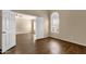 Bright bedroom with hardwood floors, light-colored walls, and a large window offering natural light at 4434 E Thistle Landing Dr, Phoenix, AZ 85044