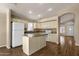 Bright kitchen featuring an island, granite counters, and white appliances at 4434 E Thistle Landing Dr, Phoenix, AZ 85044
