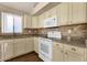 Bright kitchen with granite counters, modern appliances, and light cabinetry at 4434 E Thistle Landing Dr, Phoenix, AZ 85044
