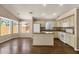 Open concept kitchen with island, dining area, and stainless appliances at 4434 E Thistle Landing Dr, Phoenix, AZ 85044
