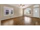 Bright, open living room with hardwood floors and a vaulted ceiling at 4434 E Thistle Landing Dr, Phoenix, AZ 85044