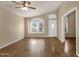 Spacious living room with hardwood floors and a front-facing window at 4434 E Thistle Landing Dr, Phoenix, AZ 85044
