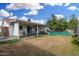 A spacious backyard extends from the covered patio, providing an inviting outdoor area at 4513 W Yucca St, Glendale, AZ 85304