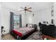Bedroom featuring a patterned rug, ceiling fan and a window for natural light at 4513 W Yucca St, Glendale, AZ 85304