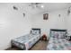 Bedroom featuring twin beds, light colored tile floor, and a ceiling fan at 4513 W Yucca St, Glendale, AZ 85304