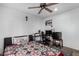 Bedroom featuring a patterned rug, ceiling fan and a desk for working or gaming at 4513 W Yucca St, Glendale, AZ 85304