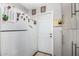 Kitchen area featuring a white refrigerator, door, and plenty of storage at 4513 W Yucca St, Glendale, AZ 85304
