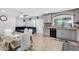 Open-concept kitchen and living area with stainless steel appliances and dining table at 4513 W Yucca St, Glendale, AZ 85304