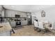 Updated kitchen with stainless steel appliances, gray cabinets and granite countertops at 4513 W Yucca St, Glendale, AZ 85304