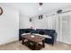 Comfortable living room featuring a blue sofa and wooden coffee table at 4513 W Yucca St, Glendale, AZ 85304