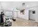 Spacious living room with tile floors, neutral paint, ample natural light, and comfortable gray furniture at 4513 W Yucca St, Glendale, AZ 85304