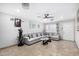 Inviting living room featuring a large gray sofa and glass coffee tables at 4513 W Yucca St, Glendale, AZ 85304