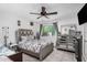 Comfortable bedroom featuring neutral décor, a ceiling fan, and a window for natural light at 4513 W Yucca St, Glendale, AZ 85304