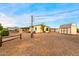 Exterior view of the home features a shed, desert landscaping, and a carport at 466 N Rennick Dr, Apache Junction, AZ 85120