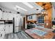 Updated kitchen features stainless steel appliances, white cabinets, and a tile countertop at 466 N Rennick Dr, Apache Junction, AZ 85120