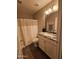 Well-lit bathroom with vanity, granite countertops, and a shower/tub combination at 4721 E Abraham Ln, Phoenix, AZ 85050
