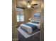 Comfortable bedroom features a neutral palette, plush rug, and a ceiling fan for added comfort at 4721 E Abraham Ln, Phoenix, AZ 85050