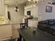Stylish kitchen and dining area, featuring granite countertops, a breakfast bar, and stainless steel appliances at 4721 E Abraham Ln, Phoenix, AZ 85050