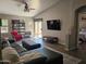 Spacious living room with tile flooring, sleek furniture, and a sliding glass door leading to the outdoor area for seamless indoor-outdoor living at 4721 E Abraham Ln, Phoenix, AZ 85050
