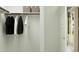 Organized closet with hanging rods and storage bins, ready for easy organization at 4748 E Amethyst Ln, San Tan Valley, AZ 85143