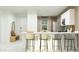 Open-concept kitchen features white cabinets, stainless steel appliances, a large island, and modern design at 4748 E Amethyst Ln, San Tan Valley, AZ 85143
